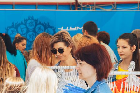 June 23, 2019 Minsk Belarus Street festivities in honor of the Second European Games People are facing sportswear sales.のeditorial素材