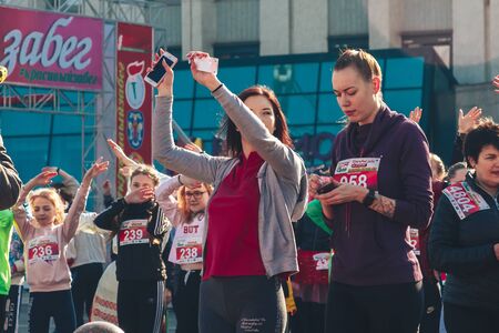 March 8, 2019 Minsk Belarus Women's Day Race on March 8 Beautiful girls athletes do warm up on the...