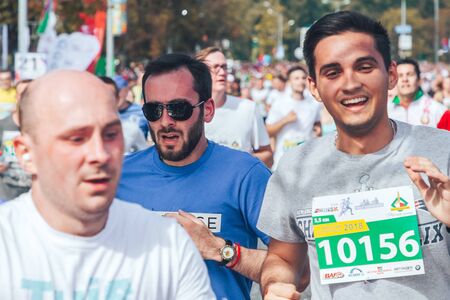 September 9, 2018 Minsk Belarus Half Marathon Minsk 2018 Happy men run a marathon on a city street