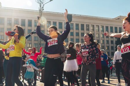 March 8, 2019 Minsk Belarus Women's Day Race on March 8 Athletes are dancing on the street before the race Close upのeditorial素材