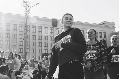 March 8, 2019 Minsk Belarus Women's Day Race on March 8 Athletes are dancing on the street before the race Black and white imageのeditorial素材