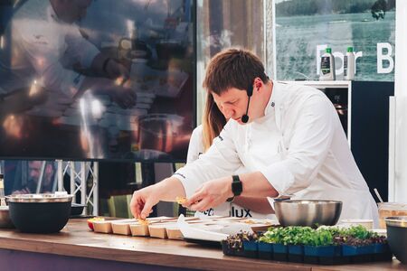 June 1, 2019 Minsk Belarus Public demonstration of cooking on the street Chef cooks food at the master classのeditorial素材