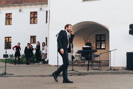 May 25, 2019 Minsk Belarus Street festivities in the evening city A man shows a theatrical...