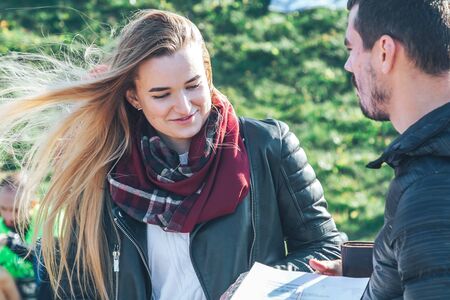 October 6, 2018 Novogrudok Belarus Castle Road A man explains to a woman how to fill out an application for a marathonのeditorial素材