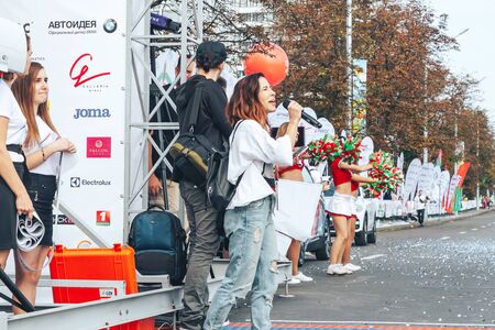 September 9, 2018 Minsk Belarus Half Marathon Minsk 2018 Woman with a microphone speaks next to a marathonのeditorial素材