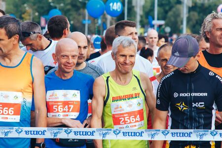 September 15, 2018 Minsk Belarus Half Marathon Minsk 2019 Mature marathon runners stand on the road...