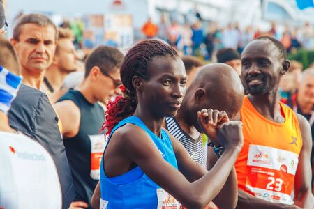 September 15, 2018 Minsk Belarus Half Marathon Minsk 2019 Woman marathon runner stretches her arms...