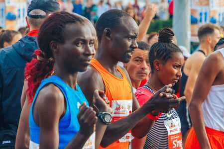 September 15, 2018 Minsk Belarus Half Marathon Minsk 2019 Athletes of different skin colors prepare for the start of the marathonのeditorial素材