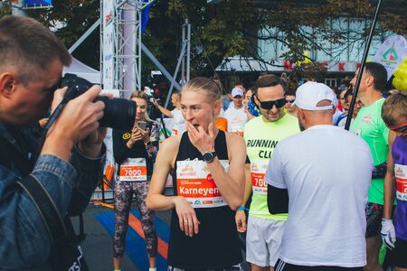 September 15, 2018 Minsk Belarus Half Marathon Minsk 2019 Marathon runners face the run when a man with a camera takes them offのeditorial素材