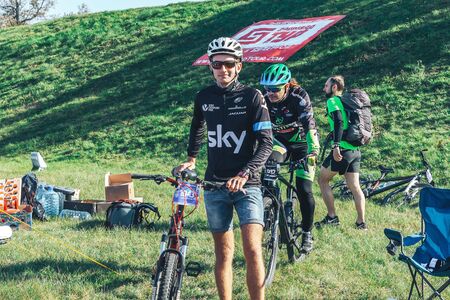 October 6, 2018 Novogrudok Belarus Castle Road Cyclists with bicycles stand in the park before the race.のeditorial素材