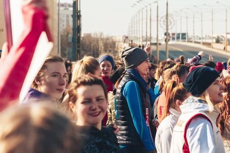 March 8, 2019 Minsk Belarus Women's Day Race on March 8 Girls stand in the square with the flagのeditorial素材