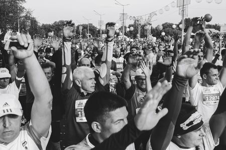 September 15, 2018 Minsk Belarus Half Marathon Minsk 2019 Happy athletes raised their hands before the start of the marathon in black and whiteのeditorial素材