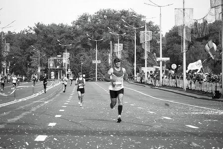 September 15, 2018 Minsk Belarus Half Marathon Minsk 2019 Mature man runs a marathon on the way to the finish line in black and whiteのeditorial素材