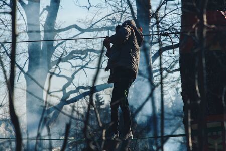 November 17, 2018 Logoisk Belarus Beetle-trail 8 LOGOISK A boy walks along a rope trail in the parkの写真素材