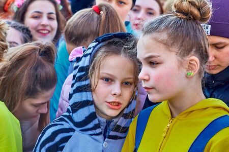 March 8, 2019 Minsk Belarus Women's Day Race on March 8 Two young girls are talking in a crowd of womenのeditorial素材