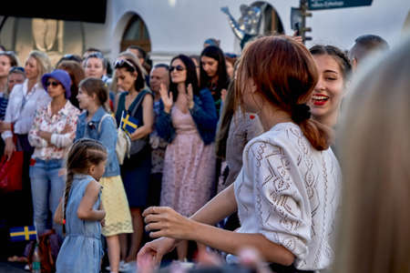 June 1, 2019 Minsk Belarus Happy teenage girls dancing at a street concertのeditorial素材