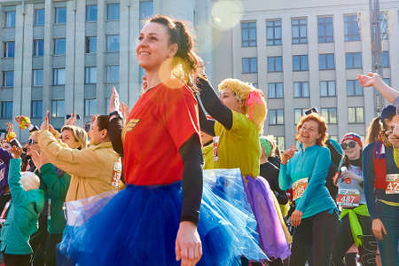 March 8, 2019 Minsk Belarus Women's Day Race on March 8 Happy women in carnival costumes dance under the rays of the spring sunのeditorial素材