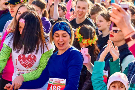 March 8, 2019 Minsk Belarus Women's Day Race on March 8 A group of emotional women takes pictures on the phone at a street concertのeditorial素材