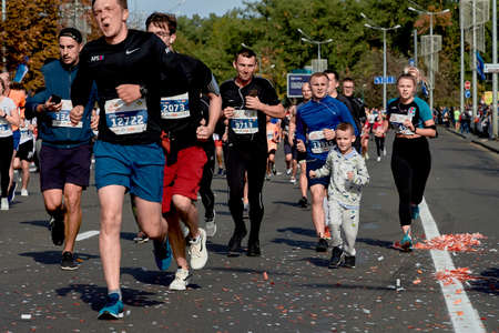 September 15, 2018 Minsk Belarus Half Marathon Minsk 2019 Adult marathon runners and little boy run a marathonのeditorial素材
