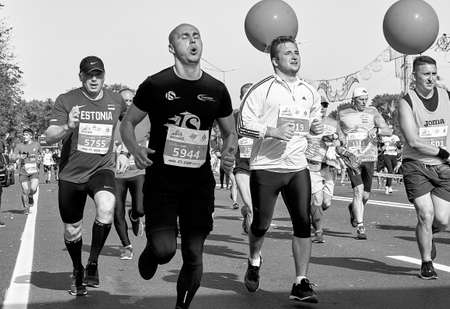 September 15, 2019 Minsk Belarus Many fast runners during a marathon race in the city In black and white,competitors during the run of the marathon race in the cityのeditorial素材