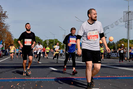 September 15, 2019 Minsk Belarus Many fast runners running after the finish line marathon. Healthy lifestyle.のeditorial素材