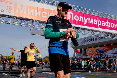 September 15, 2019 Minsk Belarus Mature athlete celebrates after finishのeditorial素材