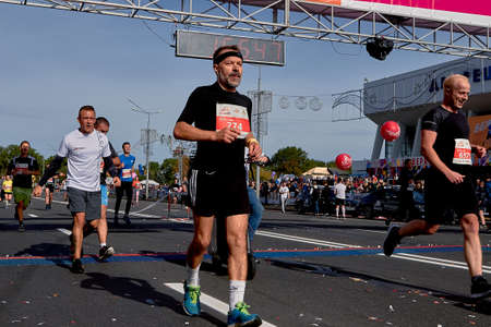 September 15, 2019 Minsk Belarus Group of unidentified people crossing the finish line in the Minsk Half Marathonのeditorial素材