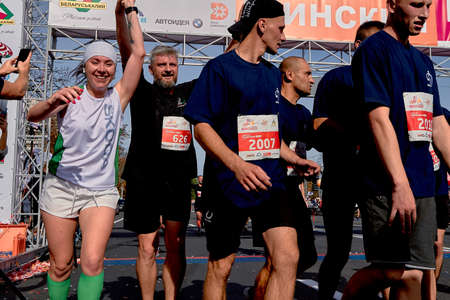 September 15, 2019 Minsk Belarus Cropped photo, group of unidentified cheerful people crossing the finish line in the marathonのeditorial素材