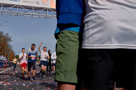 September 15, 2019 Minsk Belarus Cropped photo, athletes race, people cross the finish line on city roadのeditorial素材