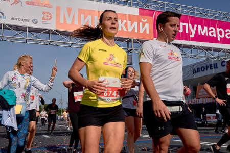 September 15, 2018 Minsk Belarus Half Marathon Minsk 2019 Close-up, marathon runners crossing the finish line on paved road in townのeditorial素材
