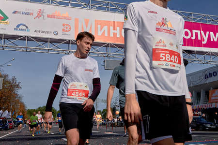September 15, 2019 Minsk Belarus Half Marathon Minsk 2019 Cropped photo,athlete in a wet shirt crossing the finish line of the marathonのeditorial素材