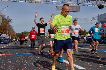 September 15, 2019 Minsk Belarus Participants cross the finish line, celebrating with arms raised.のeditorial素材