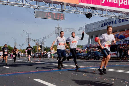 September 15, 2019 Minsk Belarus Marathon running race, people cross the finish line on city roadのeditorial素材