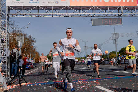 September 15, 2019 Minsk Belarus Half Marathon Minsk 2019 Marathon runners crossing the finish line on paved road in townのeditorial素材