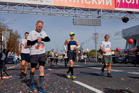 September 15, 2018 Minsk Belarus Half Marathon Minsk 2019 Marathon runners crossing the finish line on paved road in townのeditorial素材
