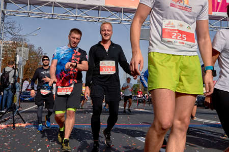 September 15, 2019 Minsk Belarus Belarus Cropped photo, marathon runners celebrate finish line crossingのeditorial素材