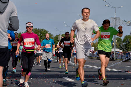 September 15, 2019 Minsk Belarus Happy runners running at the finish in the city.のeditorial素材