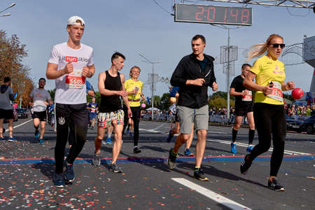 September 15, 2019 Minsk Belarus Many runners running after the finish line marathon. Healthy lifestyle.のeditorial素材