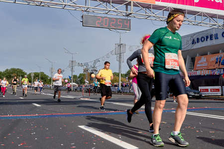 September 15, 2019 Minsk Belarus Many runners running after the finish line marathon. Healthy lifestyle.のeditorial素材