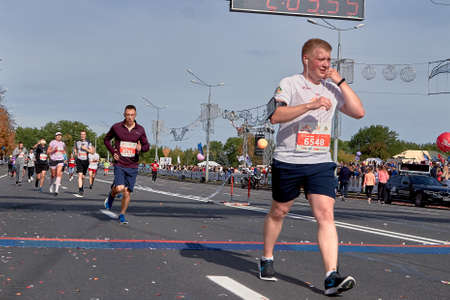 September 15, 2019 Minsk Belarus Marathon, fast man on a fall dayのeditorial素材
