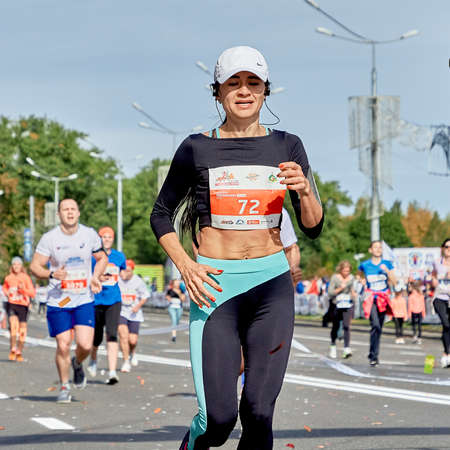 September 15, 2019 Minsk Belarus Half Marathon Minsk 2019 Woman athlete crosses the finish line on a city roadのeditorial素材