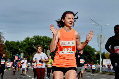 September 15, 2019 Minsk Belarus Belarus Healthy woman celebrate with arms raised crossing the finish lineのeditorial素材