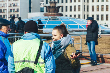 March 8, 2019 Minsk Belarus People stand in the square on a Sunny morningのeditorial素材