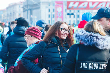 March 8, 2019 Minsk Belarus The candle flame touches the protective mask as a symbol of resistance to the coronavirusのeditorial素材