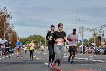 September 15, 2019 Minsk Belarus A marathon race in which a young woman crosses the finish line ahead of the participantsのeditorial素材