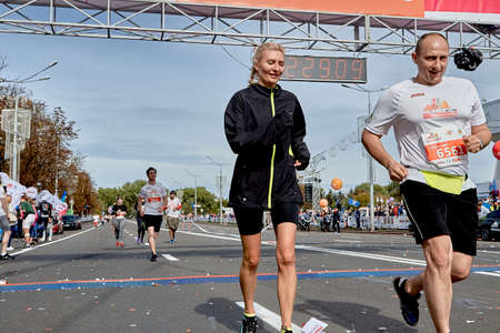 September 15, 2019 Minsk Belarus A marathon race in which a close-up of men and women crossed the finish line.のeditorial素材