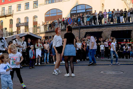 June 1, 2019 Minsk Belarus Two teenage girls dance at a street concertのeditorial素材