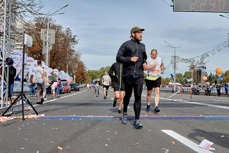 September 15, 2019 Minsk Belarus A marathon race in which an athlete with a beard crosses the finish line.のeditorial素材
