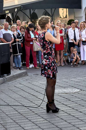 May 25, 2019 Minsk Belarus Street concert where a young woman sings with a microphoneのeditorial素材