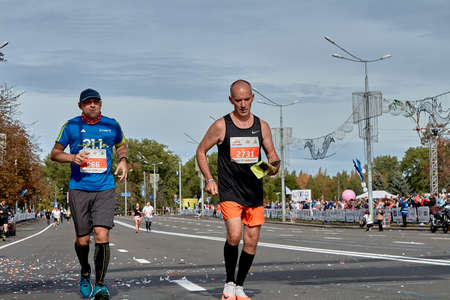 September 15, 2019 Minsk Belarus A marathon race in which two athletes run to the finish line on a city roadのeditorial素材